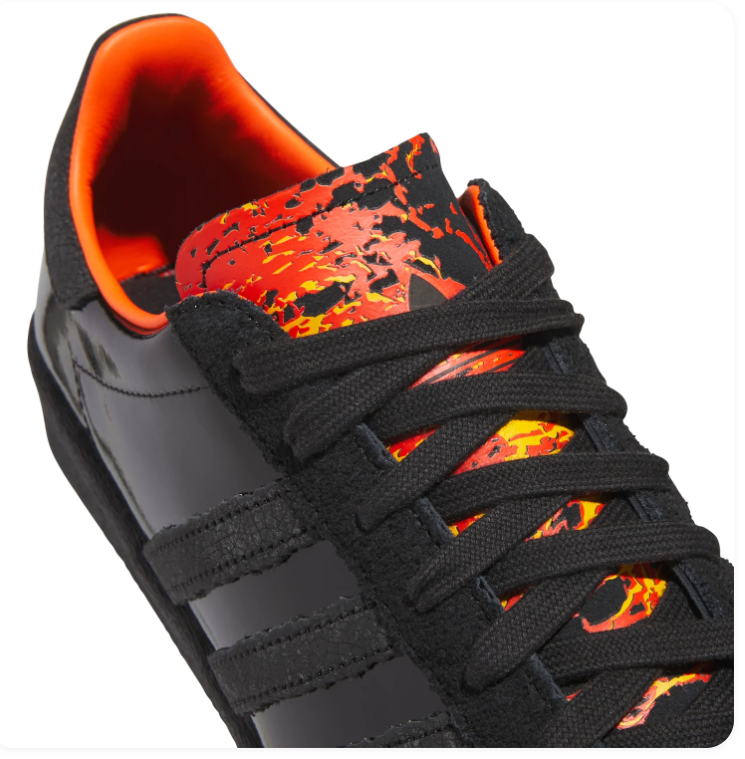 Adidas Black Glossy Sneakers with Orange Lining and Graphic Tongue